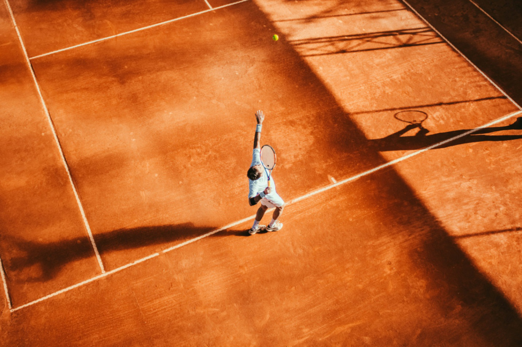 A man playing tennis in a court