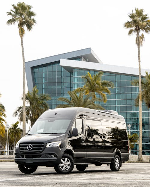 A black Mercedes-Benz Sprinter van