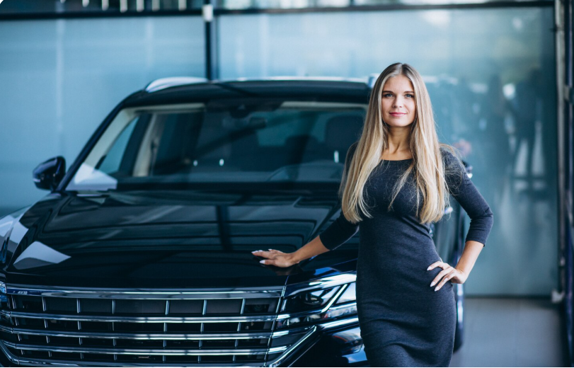 woman standing beside a luxury SUV that transports groups to Coachella music festival